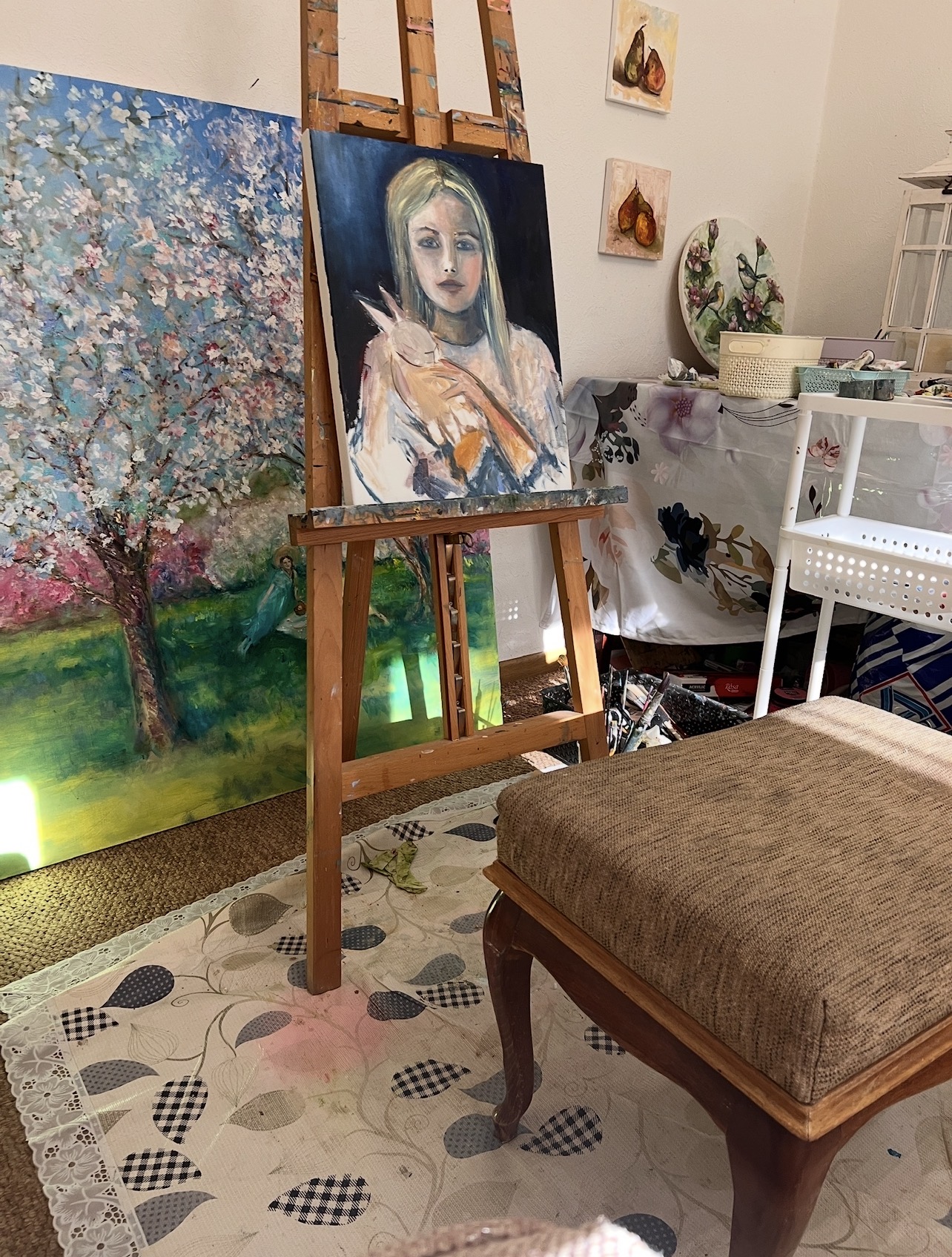 Girl with a Rabbit by Marina Stognieva during the painting process on the artist’s easel in Kyiv, 2024